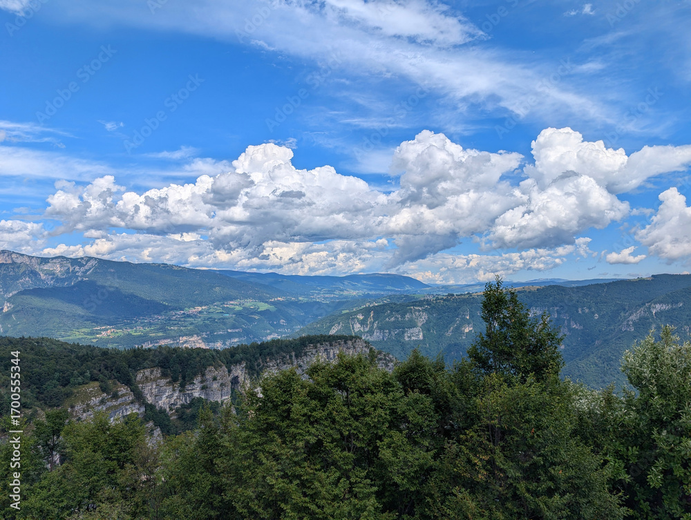 Obraz premium panoramic view of the European Alps in Northern Italy with a blue sky and white clouds