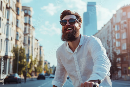 Wallpaper Mural Stylish bearded businessman riding bicycle and laughing in city center Torontodigital.ca