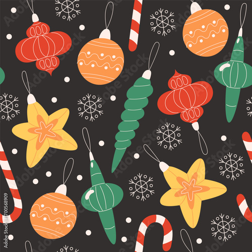 Seamless Christmas pattern with colorful baubles and snowflakes on black background