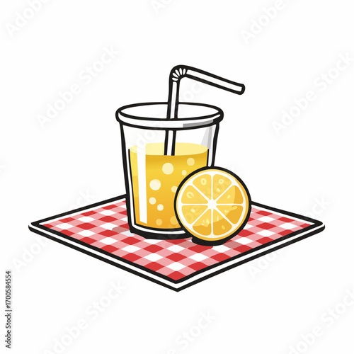 A refreshing glass of cool lemonade with a straw and a lemon slice, a classic summer citrus drink on a a red checkered picnic blanket
