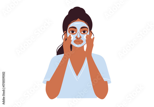 Woman applying light blue mask dark hair tan skin