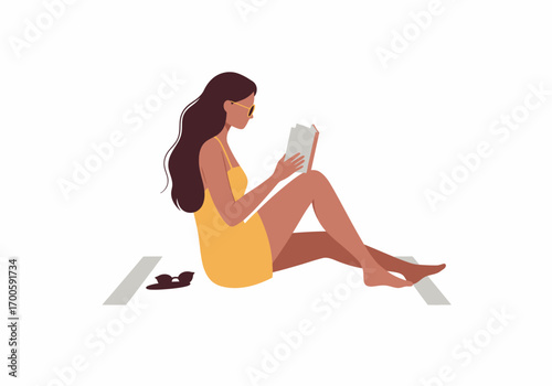 Woman in yellow dress reads book on blanket outdoors with sunglasses nearby