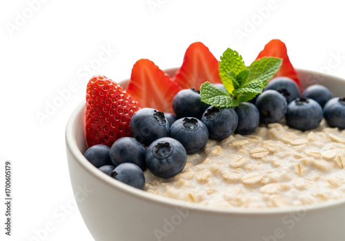 Oatmeal with blueberries and strawberries isolated on transparent background