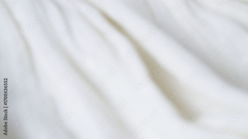 Fototapeta premium Blur white fabric texture background. Abstract blurred background of white-cream rippled. Concept of wavy cloth, bright, minimal, modern, luxury for wallpaper, print, textiles. Smooth silk surface.