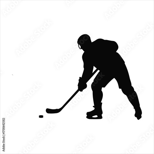 Dynamic silhouette of a hockey player skating and shooting the puck during a game