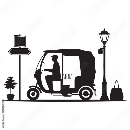 Silhouette of a driver operating a three wheeled auto rickshaw with a passenger and luggage on a street with a lamppost and plant