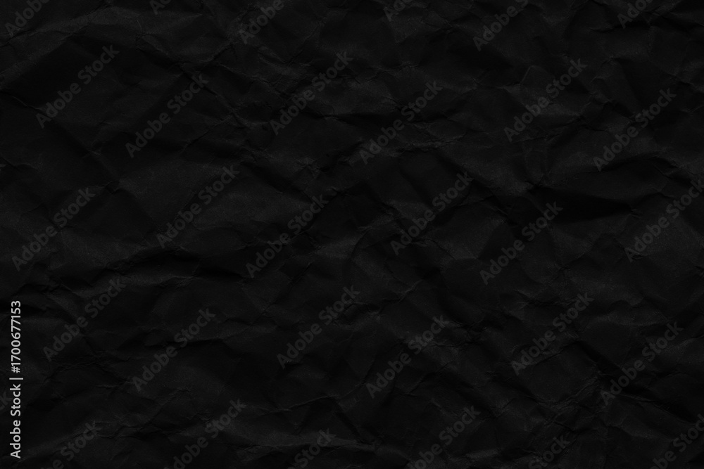 Fototapeta premium Macro crumpled black paper texture,Black paper background. Old crumpled texture.