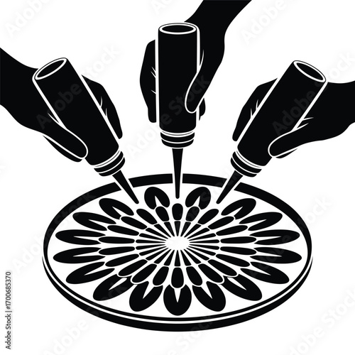 Hands decorating a circular pattern with squeeze bottles