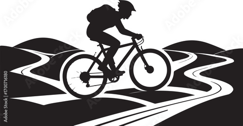Silhouette of a mountain biker riding on a winding trail with rolling hills mountain biking cyclist