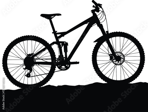Dynamic silhouette of a mountain bike against a vibrant sunset, evoking freedom and adventure for outdoor recreation, travel, and cycling enthusiasts