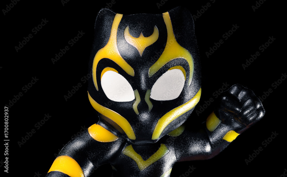 Fototapeta premium Kinder Surprise Marvel Black Panther face on the black background