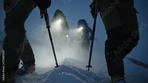 Climbers hike through deep snow at night with headlamps showing extreme winter adventure this is a great polar expedition this is a very difficult and cold team challenge