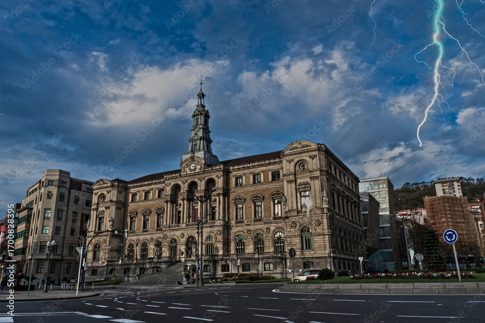 Fototapeta premium Bilbao City Hall under storm clouds and lightning.