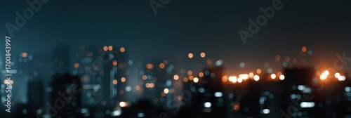 Blurred cityscape at night with glowing city lights and bokeh effect