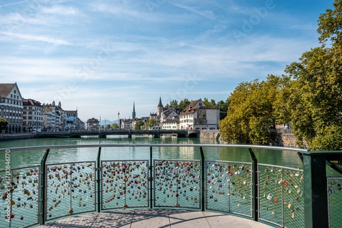 Canvas Print Scenic city view of Zurich and the Limmat river seen from Muhlesteg bridge full of love padlocks in Zurich, Switzerland