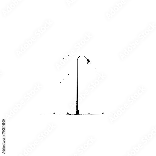 A lonely street lamp stands in the quiet night casting a gentle glow on the world around it