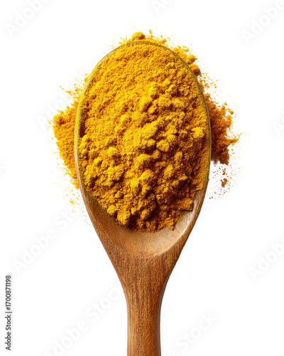 Golden spice powder in a wooden spoon