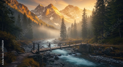 Majestic snow-capped mountains glow at sunrise, a wooden bridge spans a misty river valley.