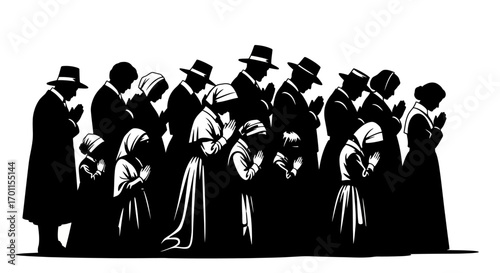 Group of people in dark clothing praying together, heads bowed, hands clasped in solemn reverence.