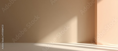 Sunlight streams across a neutral beige wall in an empty room, creating soft shadows and a minimalist aesthetic for backdrop use.