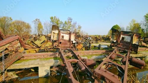 Drone view or ground level footage showcasing the vast, eerie landscape of the Rozsokha Vehicle Cemetery, an infamous site within the Chernobyl Exclusion Zone.