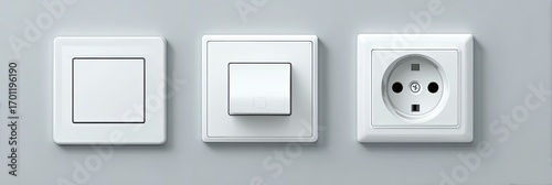 Three white electrical outlets and switches mounted on a gray wall