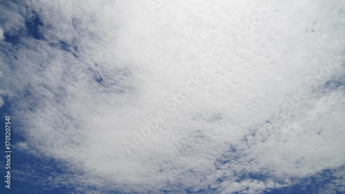 clouds and blue sunny sky,  white clouds over blue sky, Aerial view,  nature, blue sky, white clear weather. Time-lapse video 4 K.
