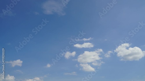 clouds and blue sunny sky,  white clouds over blue sky, Aerial view,  nature, blue sky, white clear weather. Time-lapse video 4 K.
