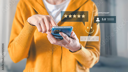 A person gives a five-star review on a smartphone, expressing satisfaction with a service by tapping the screen to leave positive feedback and a high rating.