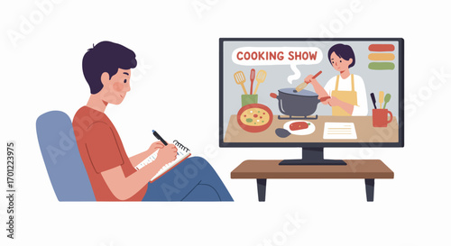 Man attentively watches a cooking show on his TV, taking notes to learn new recipes and culinary skills at home.