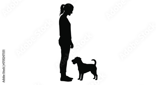 a silhouette of a girl standing beside her small dog