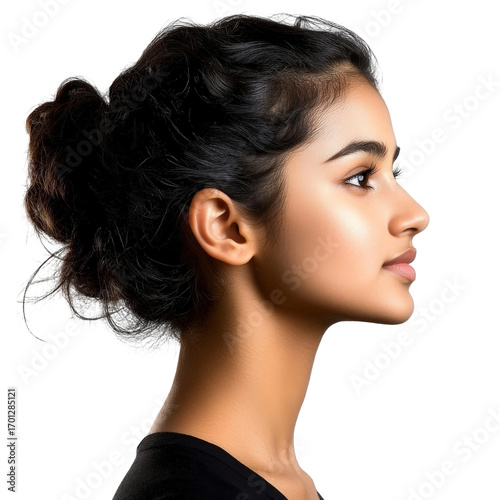 Graceful young woman in profile with beautiful hair and natural makeup against a neutral background, showcasing elegance and confidence