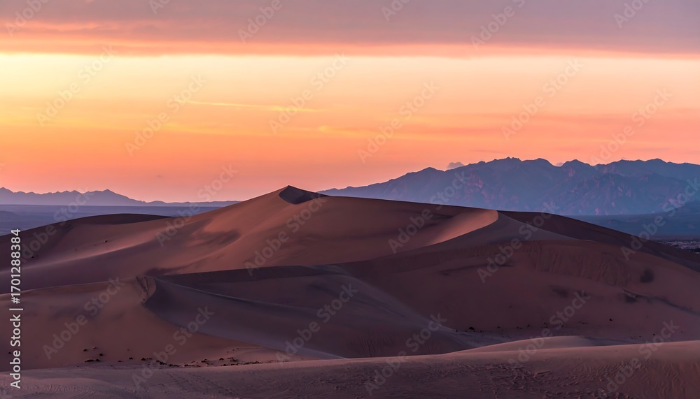 Fototapeta premium Sunrise over sand dunes, pastel colors, mountains in distance