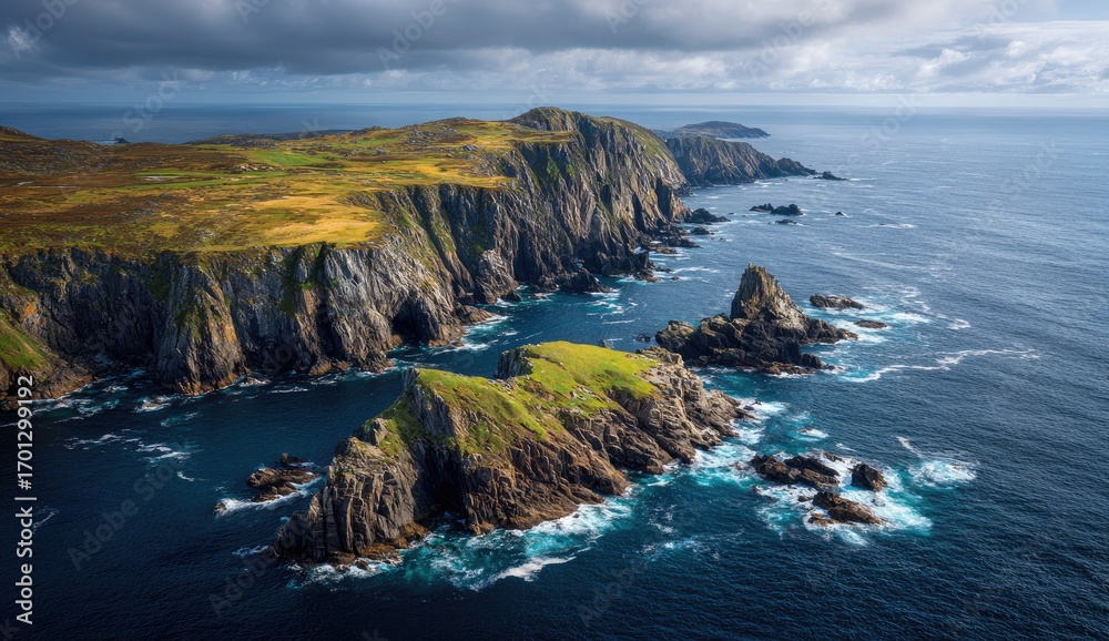 Fototapeta premium Rugged coastline with dramatic cliffs and emerald hills meet a stormy ocean