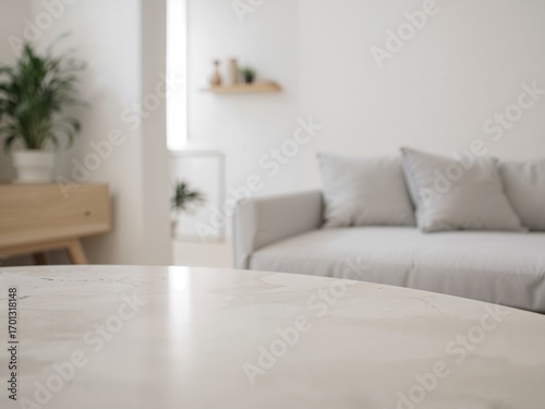 An empty white table with a blurred background of a bright, modern, and minimalist living room.