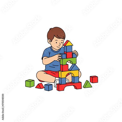 A young boy sits cross-legged, engrossed in building a colorful block tower