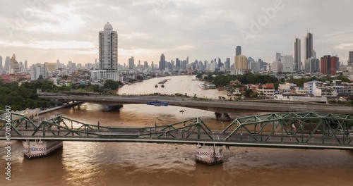Stunning Hyperlapse Captures Vibrant Urban Architecture of Bangkoks Iconic Cityscape with Bustling River and Skyline Bridge