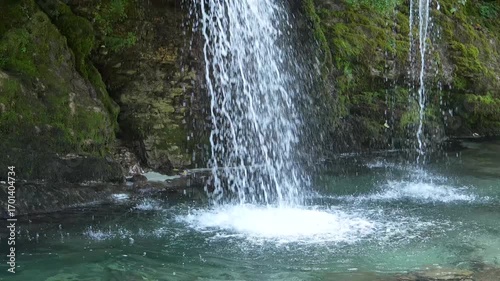 Kaghu waterfall. Magnificent moss covered levitating rock waterfall in the heart of the Caucasus mountains, near Martvili & Balda canyon. Georgia