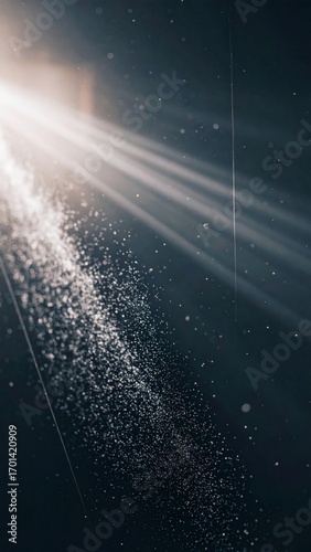 Ethereal Shafts of Light Illuminating Dense Particle Cloud Against Dark Backdrop Vertical
