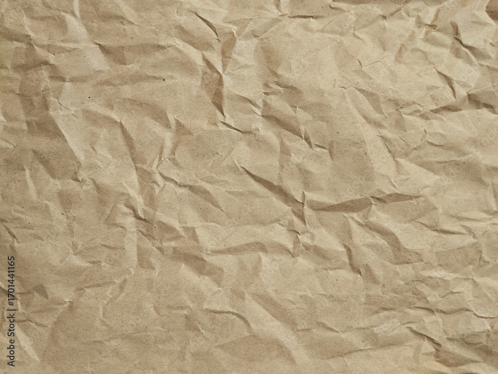 Obraz premium Abstract crumpled brown paper texture background 