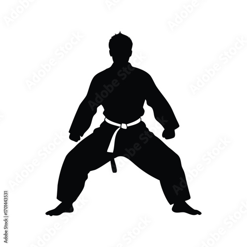 Silhouette of a karate fighter in a ready stance against white backdrop, martial artist in traditional gi silhouette vector illustration