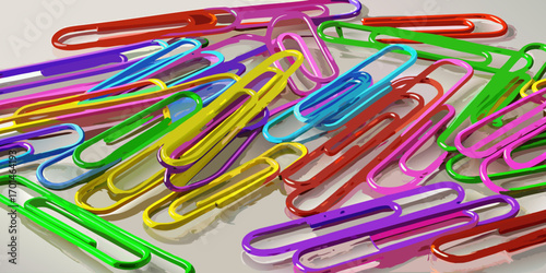 Colorful paperclips scattered randomly on a white background, showcasing a variety of bright hues and overlapping arrangements.