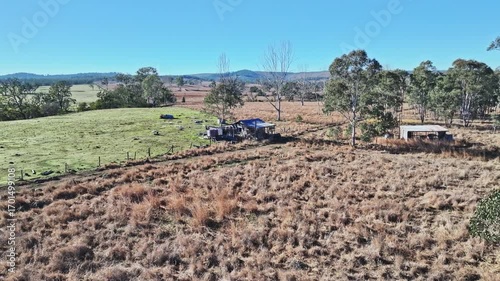 Outback Australia, rural Queensland landscape, aerial drone, old deserted cottage with countryside and blue sky