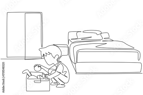 Single continuous line drawing a boy tidying up toys and putting them in the toy box. Learn to be responsible as early as possible. National Clean Your Room Day. One line design vector illustration