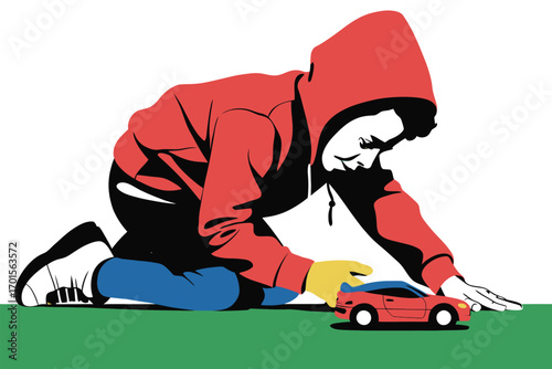Young boy wearing a red hoodie plays with a red toy car on a green surface