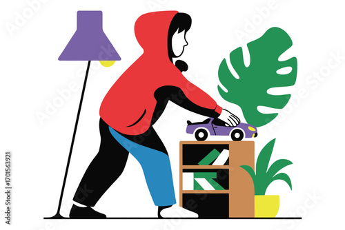 Young child in red hoodie plays with toy car on bookshelf in cozy room
