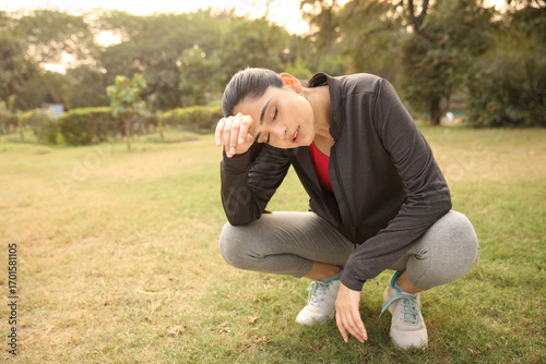 Sweaty Woman Trying To Wipe Her Head Sweat Through Her Hands After Jogging