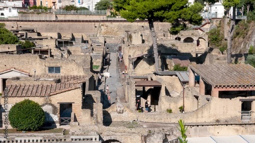 Timelapse of visitors walking through the narrow ancient streets of Herculaneum, the Roman city destroyed by the eruption of Mount Vesuvius in 79 AD. Naples, Italy.