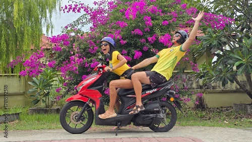 brazilian coiple on a scooter