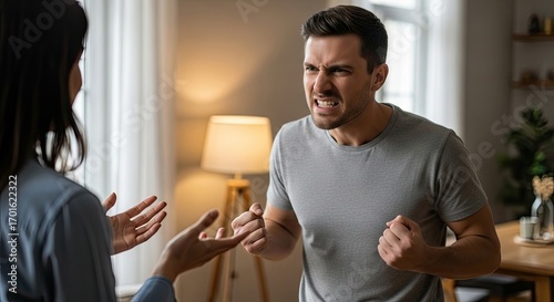 A man and a woman arguing in a living room.